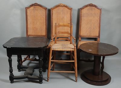 three chairs and a table are sitting next to each other
