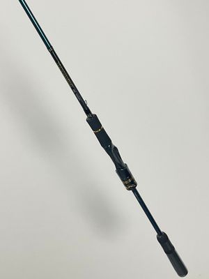 a fishing rod on a white surface with a white background