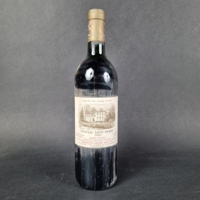 a bottle of wine with a brown label sitting on top of a table