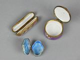 three miniature porcelain objects are sitting on a table