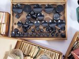 a lot of different items in a box on the table