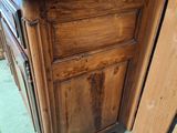 a wooden cabinet with a drawer on top of it