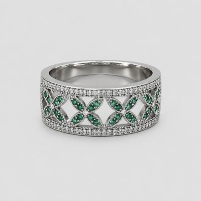 a white gold ring with green and white diamonds