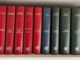 many books that are on a shelf in a book case