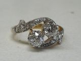 an image of a close up of a diamond ring on a table