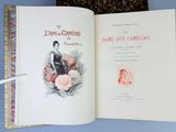 an open book with a picture of a woman holding a fan