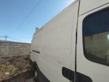 a white van that is parked on the side of the road