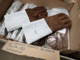 a cardboard box filled with gloves and gloves for sale