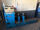 a blue machine that is sitting in a room