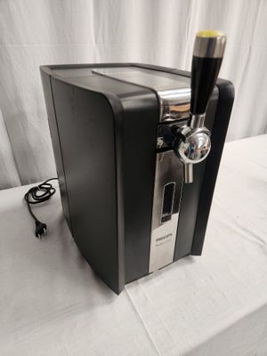 an image of a beer dispenser on a table
