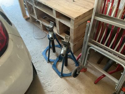 a bike that is sitting on a stand in a garage