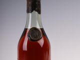a close up of a bottle of wine sitting on a table