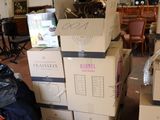 many boxes stacked on top of each other in a room