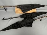 two umbrellas that are sitting on a table