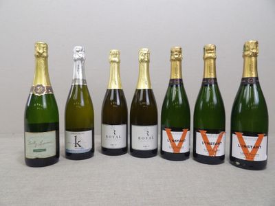 six bottles of wine are lined up on a table