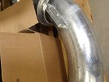 a metal pipe that is attached to a cardboard box