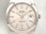 a rolex watch with a white dial on a bracelet