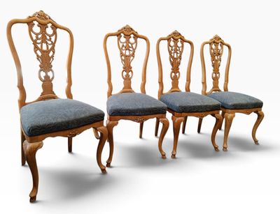 set of four antique dining chairs with blue upholstered upholstered cushions