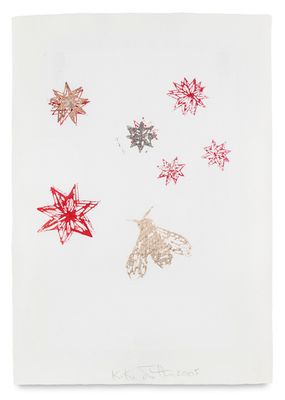 a white paper with red and silver stars on it