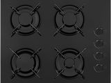 gros plan d'une cuisinière noire à quatre brûleurs