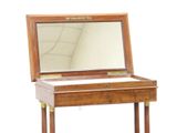 a small wooden table with a mirror on top of it