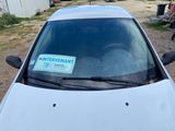 a car that has a sticker on the windshield of it