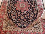 an oriental rug is on the floor in a living room