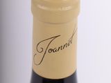 a bottle of wine that is sitting on a table