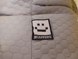a bed with a pillow that has a patch on it