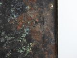 an old rusty metal door with rust on it