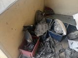 a pile of junk in the corner of a room