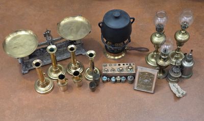 a lot of antique brass items on the table