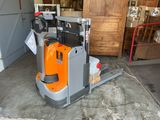 a forklift truck that is parked in a garage