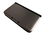 a close up of a black tablet computer on a white surface