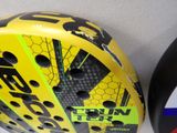 a close up of a yellow and black helmet with numbers on it