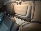 a seat in the back of a car that has been painted white