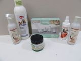 a white counter top with a lot of cleaning products on it