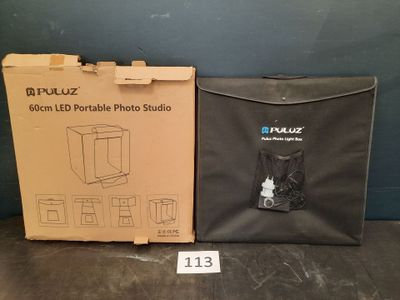 two boxes of electronics sitting on a table next to each other