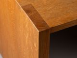 close up view of a wooden table with a wooden edge