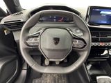 the interior of a car with a steering wheel and dashboard controls