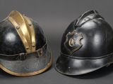 two helmets with gold accents are sitting side by side on a black background