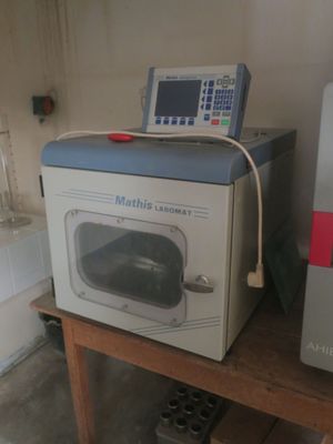 a microwave sitting on a table next to a freezer