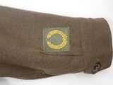 a close up of a military uniform with a badge on it
