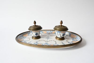 two salt and pepper shakers sitting on a plate