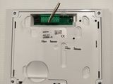 a close up of a white electronic device on a white surface