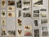 a lot of old postcards on the table