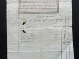 a piece of paper with writing on it sitting on top of a table