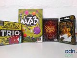several games are lined up in a row on a table