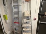 a ladder that is leaning against a wall in a room