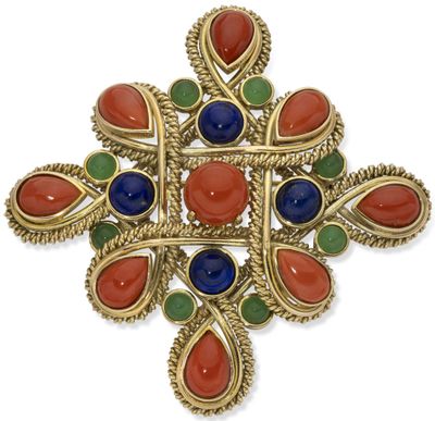 a close up of a broochle with many colored stones on it